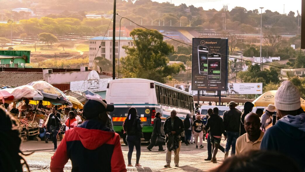 Residents and vendors navigate a busy street in Manzini as everyday goods and services show minimal price changes. Photo by Khaya Motsa