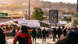 Residents and vendors navigate a busy street in Manzini as everyday goods and services show minimal price changes. Photo by Khaya Motsa