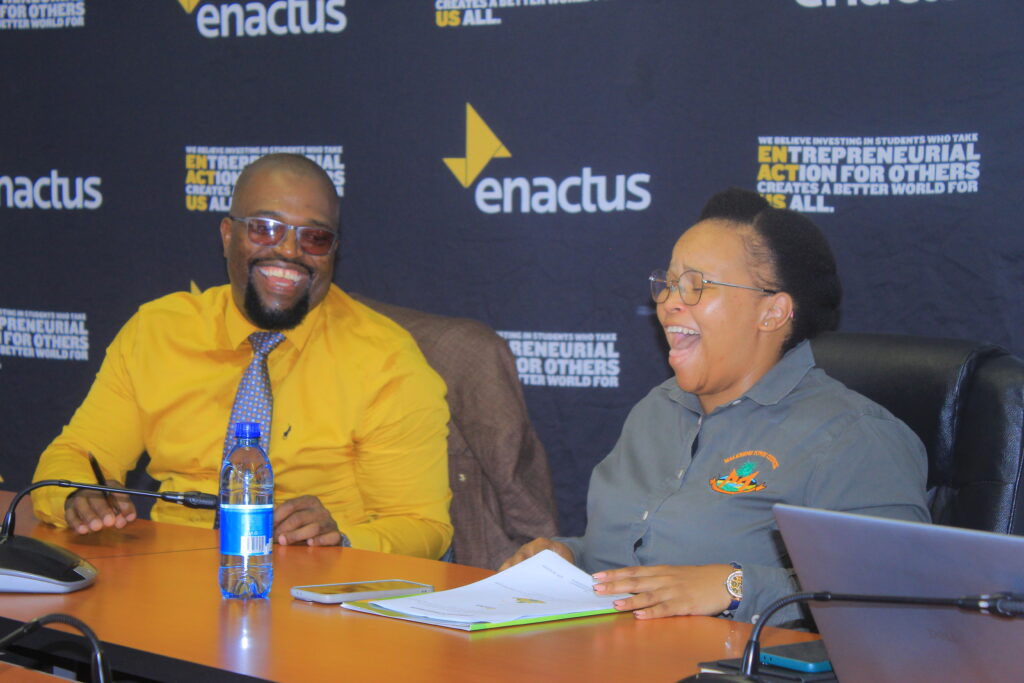 Enactus Eswatini Country Director Sabelo Dlamini and Malkerns Town Council Acting Town Clerk Nokwanda Kgomo sign the Memorandum of Understanding that paves the way for a year-long entrepreneurship development programme targeting unemployed youth in Malkerns.
