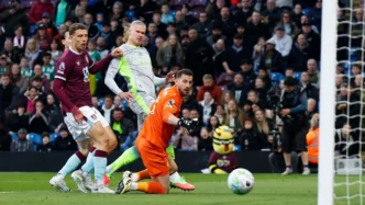 Erling Haaland celebrates after scoring the only goal of the game for Manchester City against relegated Burnley at Turf Moor, a result that sent City to the top of the Premier League table.