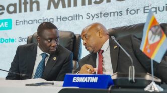 Minister of Health, Hon. Mduduzi Matsebula, engages with a senior official from the East Central and Southern Africa Health Community during a panel discussion at an unnamed event. Photo: ECSA HC.
