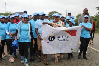 Tryphinah Mvubu, founder of Autism Eswatini, joins Deputy Prime Minister Thulisile Dladla during the Autism Awareness Month march
