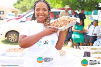 Community members prepare nutritious meals using indigenous crops at the Mbuluzi Ecosystems Restoration Project display in Mkhiweni Inkhundla.