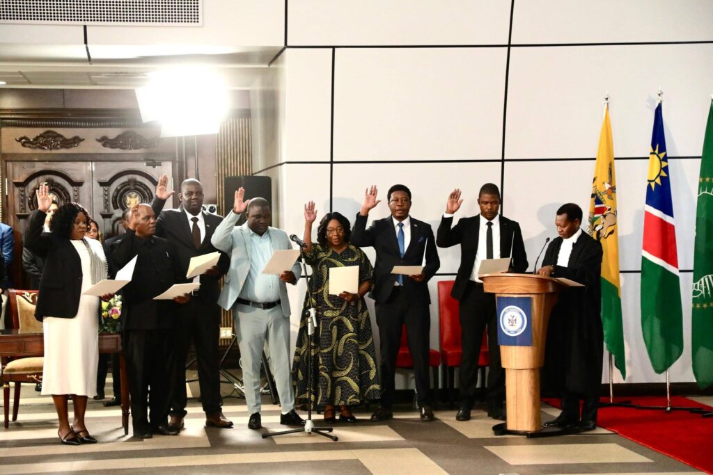 Newly appointed ministers raise their right hands as they take the oath of office before President Netumbo Nandi-Ndaitwah at State House in Windhoek.