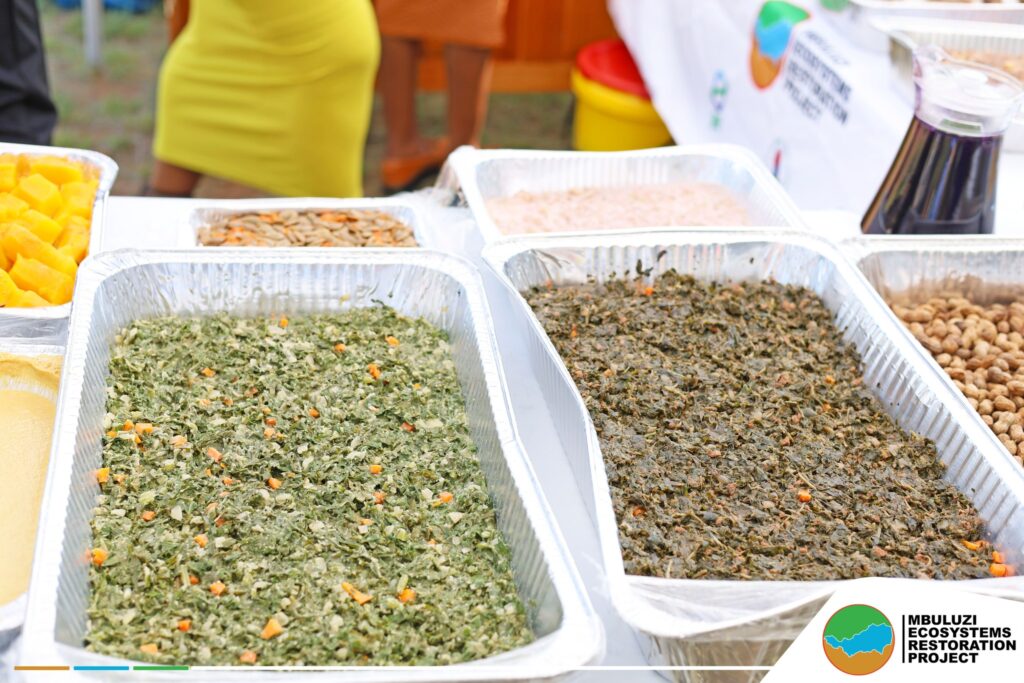 Community members prepare nutritious meals using indigenous crops at the Mbuluzi Ecosystems Restoration Project display in Mkhiweni Inkhundla.