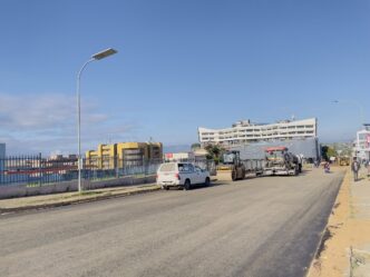 Construction teams lay the bitumen treated base along Nkoseluhlaza Street as rehabilitation works progress in Manzini.
