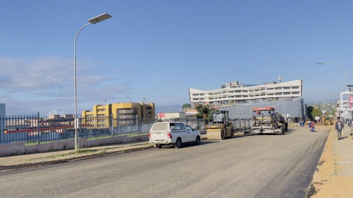 Construction teams lay the bitumen treated base along Nkoseluhlaza Street as rehabilitation works progress in Manzini.