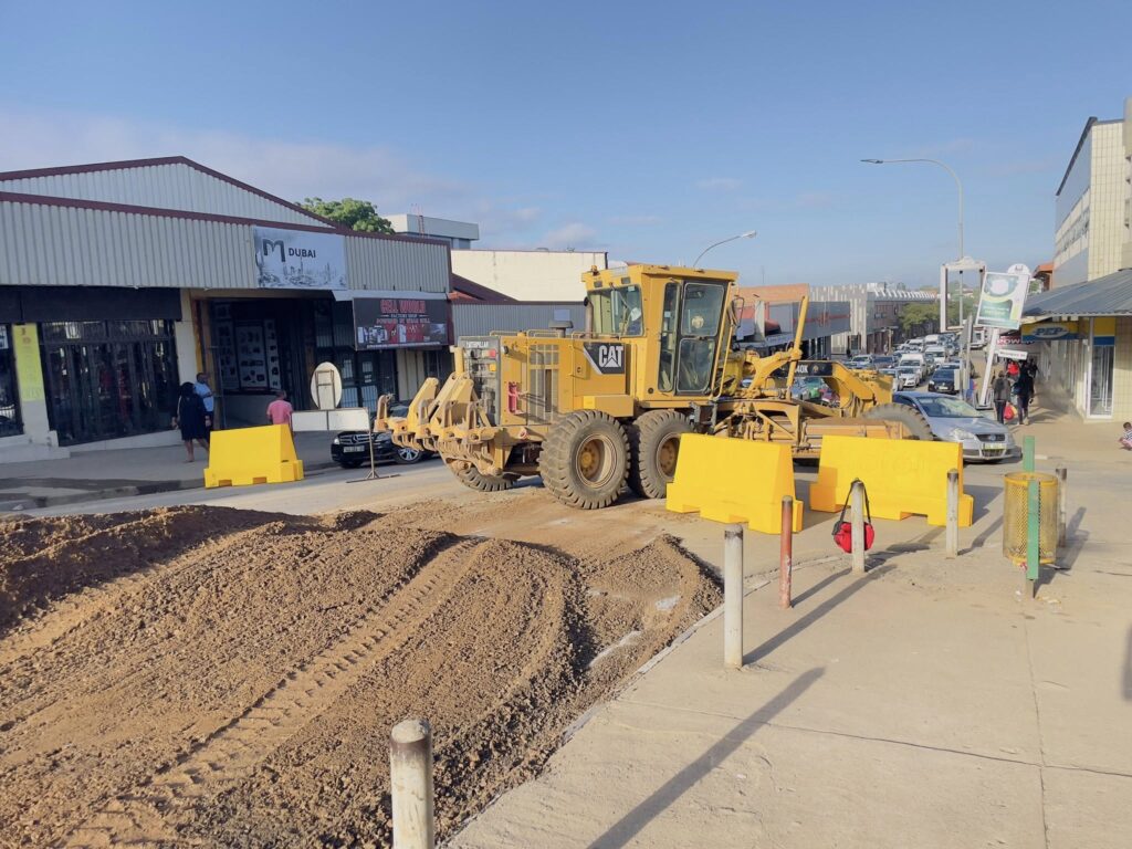 Construction teams lay the bitumen treated base along Nkoseluhlaza Street as rehabilitation works progress in Manzini.