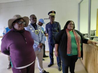 Minister Hon. Lucia Iipumbu interacts with officials at Ruacana Border Post, acknowledging their dedication to ensuring smooth and safe border operations.