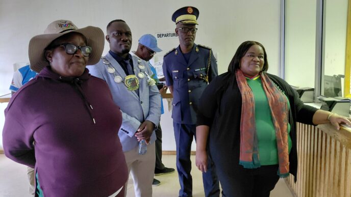 Minister Hon. Lucia Iipumbu interacts with officials at Ruacana Border Post, acknowledging their dedication to ensuring smooth and safe border operations.