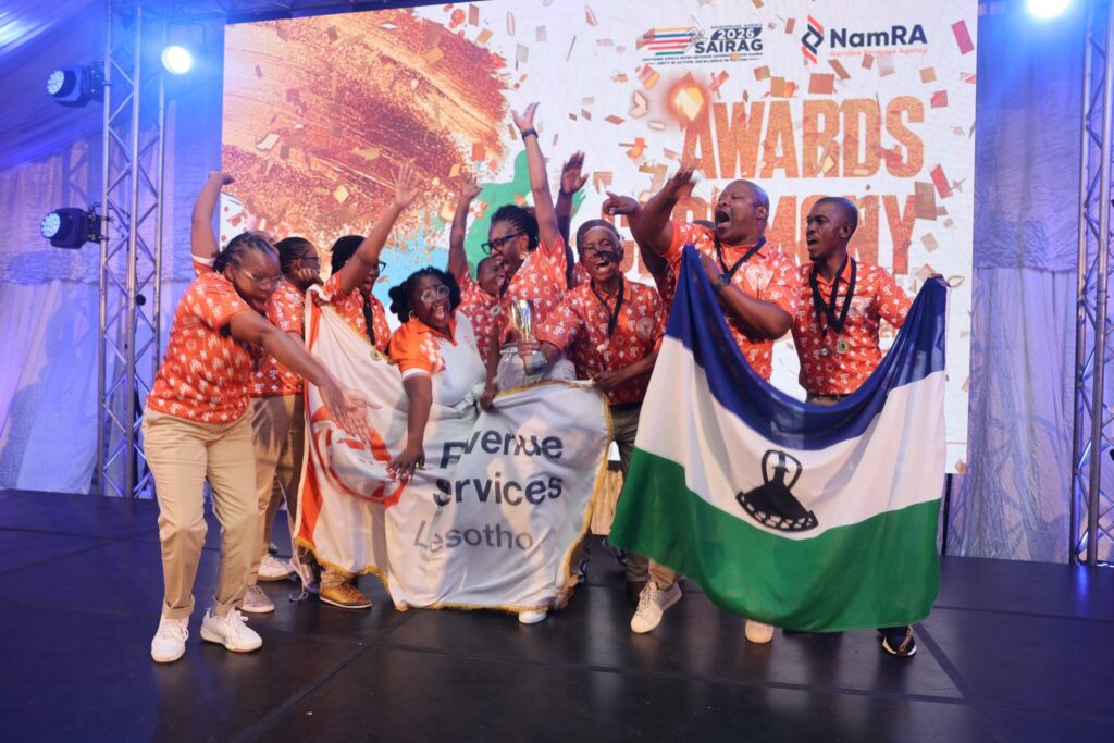 Team Lesotho celebrates their impressive medal haul at SAIRAG 2026, holding gold, silver, and bronze trophies won in individual and team events. Photo by RSL