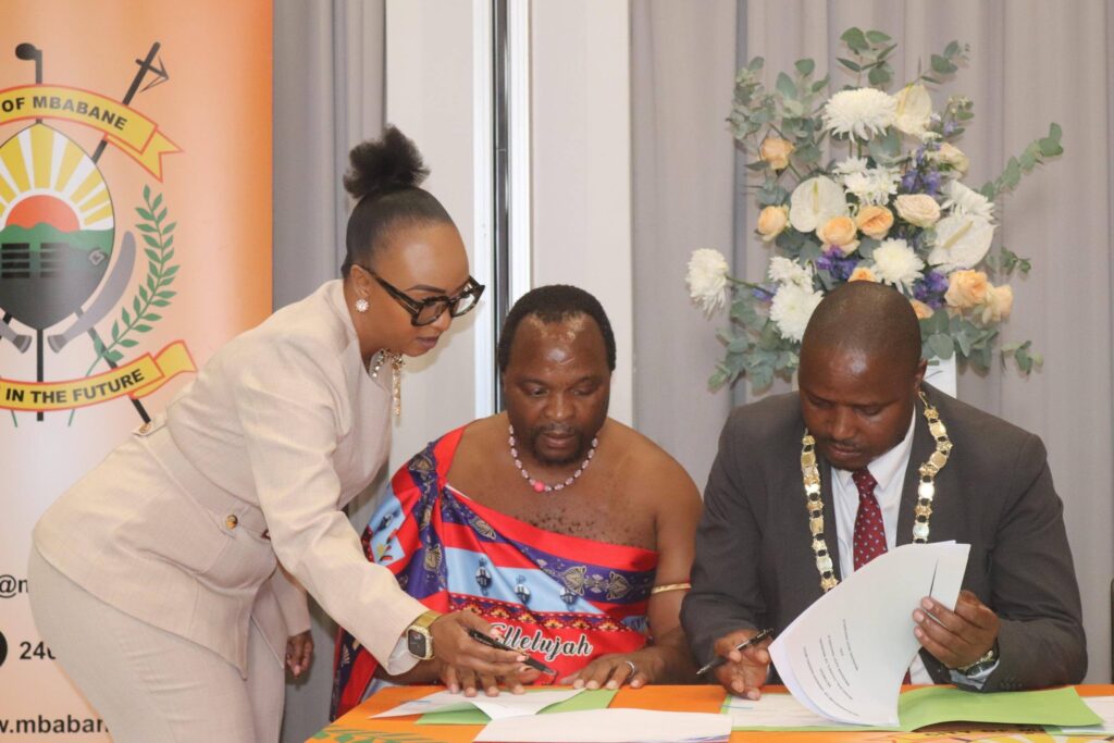 Mayor of Mbabane and representatives from Mbabane East and Mbabane West Inkhundla sign the Memorandum of Understanding at Hilton Garden Inn in Mbabane.