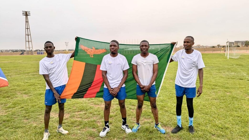 Zambia Revenue Authority players celebrate with their national flag after winning the SAIRAG 2026 football title in Swakopmund. Photo by Zambia Revenue Authority