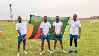Zambia Revenue Authority players celebrate with their national flag after winning the SAIRAG 2026 football title in Swakopmund. Photo by Zambia Revenue Authority