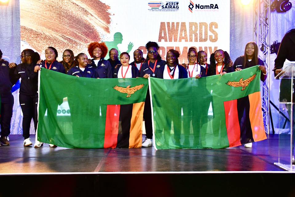 Zambian participants celebrate their overall and football victories at SAIRAG 2026, holding their trophies proudly. Photo by ZRA.