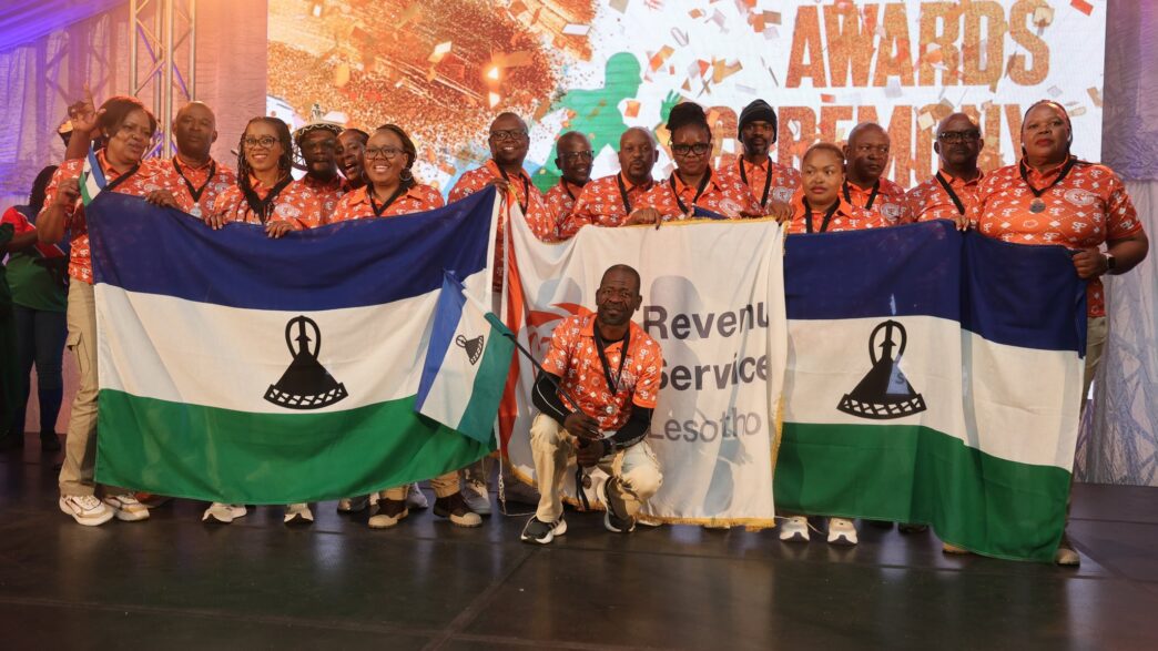 Team Lesotho celebrates their impressive medal haul at SAIRAG 2026, holding gold, silver, and bronze trophies won in individual and team events. Photo by RSL