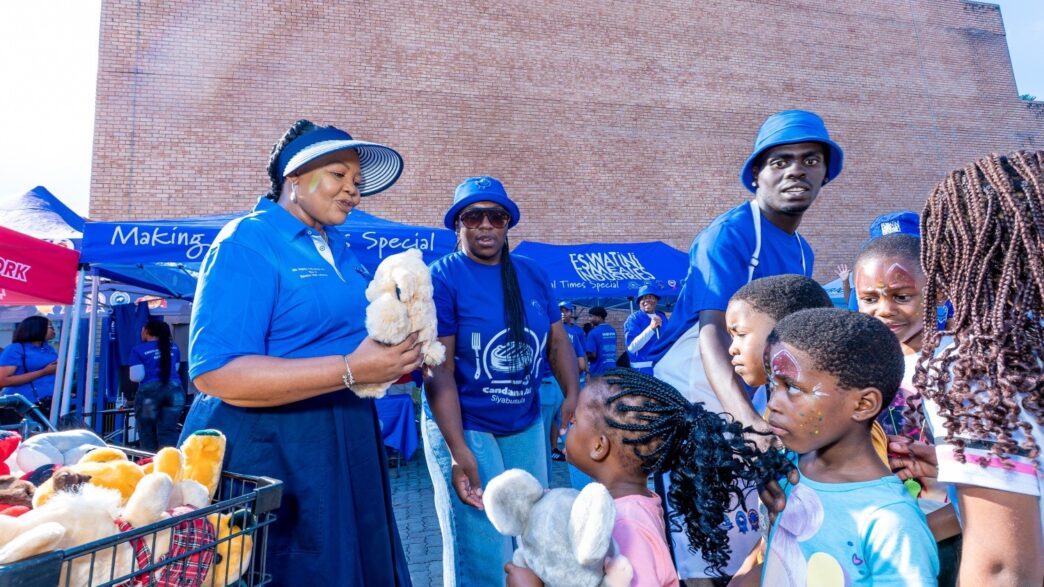 Minister for Foreign Affairs and International Cooperation Pholile Shakantu presents toys and gifts to children who attended the Embiveni Meats Candana Ja activation, bringing smiles to over 40 young guests. Photo by Tribe Studios.