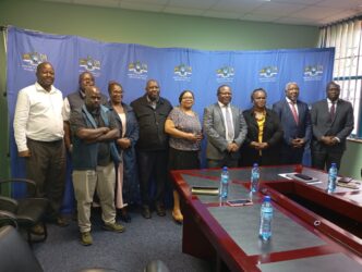 Honourable Minister Manqoba Khumalo and Business Federation of Eswatini leaders pose for a group photo during discussions on local business participation in the COMESA Summit.