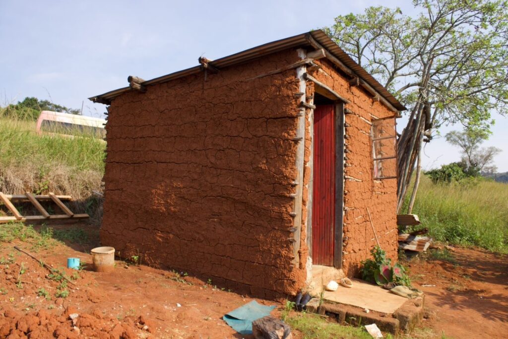 The dilapidated stick and mud house that 65-year-old Phineas Jonah Dlamini of Nsangwini called home before the Catholic Church and government stepped in to build him a new house. Photo: Supplied