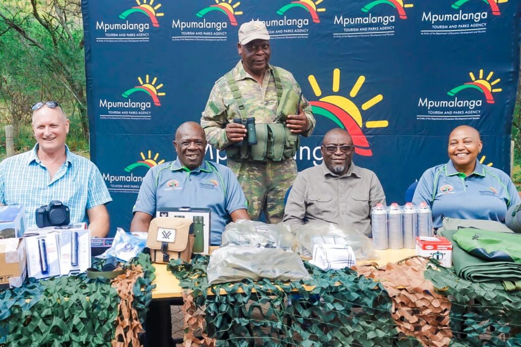 Interim Chairperson of the Mpumalanga Tourism and Parks Agency Board Mr. Fish Mahlalela, Acting Chief Executive Officer Mr. Lemmy Mdluli and Executive Manager for Biodiversity Conservation Ms. Nomcebo Kunene pictured with some of the anti-poaching equipment valued at over R500,000 donated through GEF7 funding at Loskop Dam Nature Reserve.