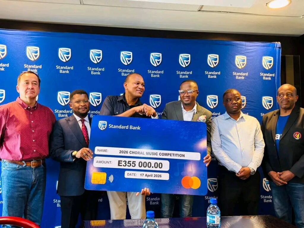 Standard Bank Eswatini Chief Executive Mvuselelo Fakudze (centre) hands over a cheque to representatives of Eswatini Choral Society