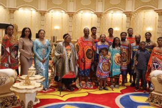 His Majesty King Mswati III and the Queen Mother, surrounded by members of the royal family