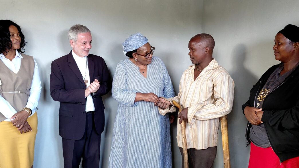 Deputy Prime Minister Thulisile Dladla hands over the keys to one of the newly built houses during a handover ceremony held across several inkhundla
