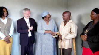 Deputy Prime Minister Thulisile Dladla hands over the keys to one of the newly built houses during a handover ceremony held across several inkhundla