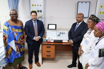 Health Minister Mduduzi Matsebula (left) receives four blood gas analysers from U.S. Chargé d'Affaires Marc Weinstock during a handover ceremony at Raleigh Fitkin Memorial Hospital in Manzini