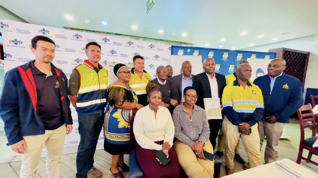 Ministry of Public Works and Transport officials and representatives of the WBHO Construction and Stefanutti Stocks joint venture pose for a group photo following the signing of the construction contract for the upgrading of the MR14 and MR21 roads