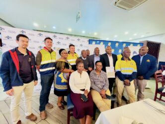 Ministry of Public Works and Transport officials and representatives of the WBHO Construction and Stefanutti Stocks joint venture pose for a group photo following the signing of the construction contract for the upgrading of the MR14 and MR21 roads