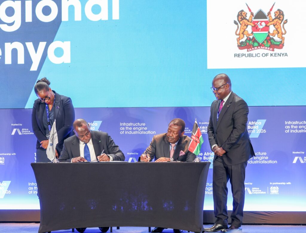 AFC President and CEO Samaila Zubairu and Kenya's Prime Cabinet Secretary Musalia Mudavadi sign the Host Country Agreement establishing AFC's first regional office in Nairobi, as President William Ruto looks on during the AFC Annual General Meeting.