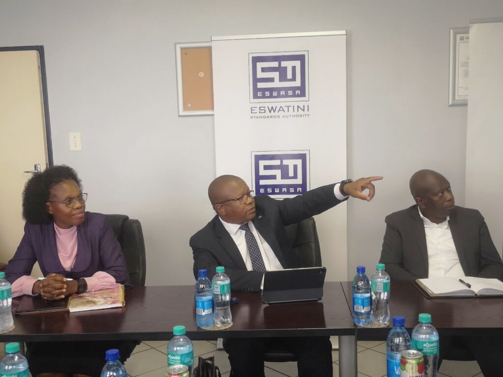 Minister of Commerce, Industry and Trade Manqoba Khumalo listens to the Eswatini Standards Authority's 2024 to 2025 progress report at the ESWASA offices