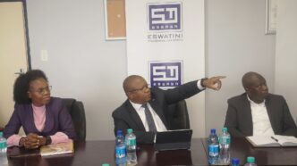 Minister of Commerce, Industry and Trade Manqoba Khumalo listens to the Eswatini Standards Authority's 2024 to 2025 progress report at the ESWASA offices