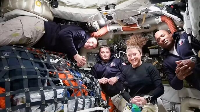 The Artemis II crew, from left, Canadian astronaut and mission specialist Jeremy Hansen, Commander Reid Wiseman, mission specialist Christina Koch and pilot Victor Glover as they appear in a video conference from the moon's orbit Thursday, April 2, 2026. (NASA via AP)