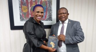 Honourable Minister of Commerce, Industry and Trade, Manqoba Khumalo with award-winning author Colisile Tfwala