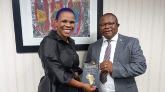 Honourable Minister of Commerce, Industry and Trade, Manqoba Khumalo with award-winning author Colisile Tfwala