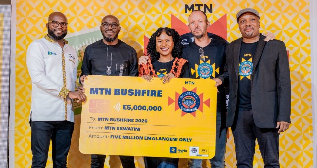 MTN Eswatini officials, MTN Bushfire organisers and partners pose for a group photo with the E5 million cheque during the official launch of MTN Bushfire 2026 at House on Fire in Malkerns.