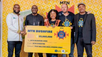 MTN Eswatini officials, MTN Bushfire organisers and partners pose for a group photo with the E5 million cheque during the official launch of MTN Bushfire 2026 at House on Fire in Malkerns.
