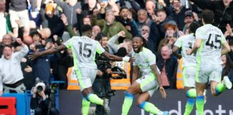 Marc Guehi celebrates with his Manchester City team mates after scoring the second goal in their 3-0 Premier League win over Chelsea at Stamford Bridge on Sunday.