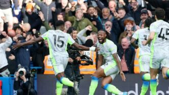 Marc Guehi celebrates with his Manchester City team mates after scoring the second goal in their 3-0 Premier League win over Chelsea at Stamford Bridge on Sunday.