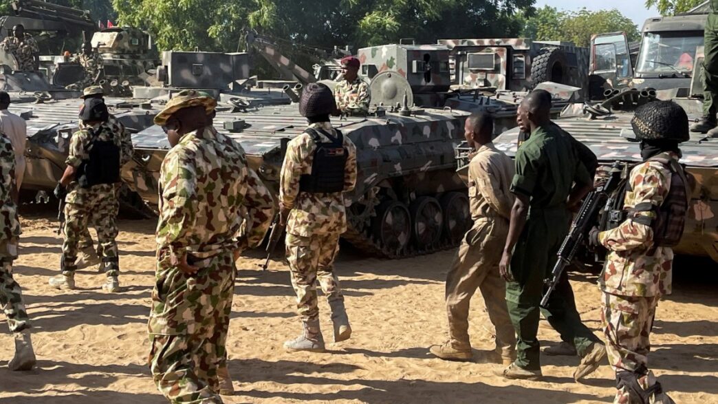 Nigerian soldiers walk past military tanks in Maiduguri, Borno State, Nigeria on November 7, 2025 [File: Ahmed Kingimi/Reuters]