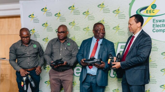 EEC Managing Director Ernest Sipho Mkhonta, MOTRACO General Manager Aderito Sousa, Minister of Education and Training Owen Nxumalo, Members of Parliament and school representatives pose with some of the 1,200 pairs of shoes donated to schools along the MOTRACO 400kV transmission line during the handover ceremony held at the EEC Learning and Conference Centre in Manzini on April 10, 2026. Photo: Supplied