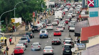 Vehicles navigate through Manzini city centre