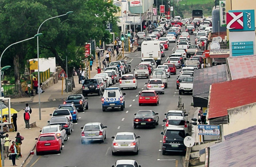 Vehicles navigate through Manzini city centre