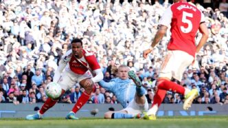 Erling Haaland tucks the ball into the bottom corner to restore Manchester City's lead against Arsenal at the Etihad Stadium, securing a 2-1 victory that has thrown the Premier League title race wide open, April 19, 2026.