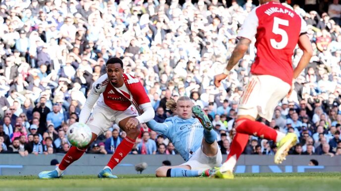 Erling Haaland tucks the ball into the bottom corner to restore Manchester City's lead against Arsenal at the Etihad Stadium, securing a 2-1 victory that has thrown the Premier League title race wide open, April 19, 2026.