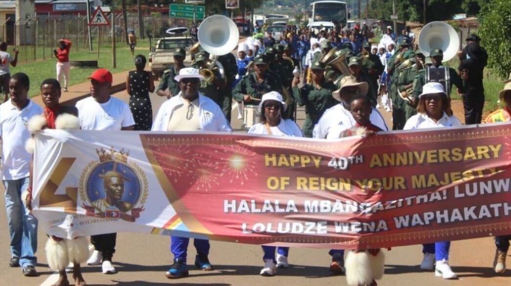 Community members, officials and performers fill the streets of Ezulwini during a roadshow led by the Ministry of Home Affairs and Ezulwini Municipality in honour of His Majesty King Mswati III's 40 years on the Throne and 58th birthday celebrations. | Photo: Supplied