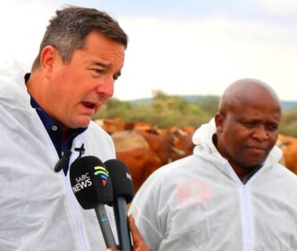 South African Minister of Agriculture John Steenhuisen addresses farmers, veterinary officials and community leaders during a joint foot-and-mouth disease vaccination and awareness drive along the Trans Kalahari Corridor at Swartkopfontein