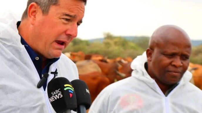 South African Minister of Agriculture John Steenhuisen addresses farmers, veterinary officials and community leaders during a joint foot-and-mouth disease vaccination and awareness drive along the Trans Kalahari Corridor at Swartkopfontein